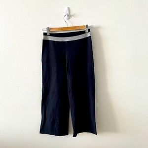 Lululemon black wide leg crop yoga pants. Size 4. White mesh detailing.
